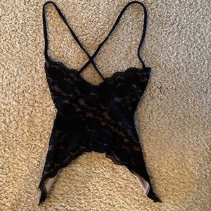 Charlotte Russe Black Lace Top. It Crisscrosses in the back and ties twice.